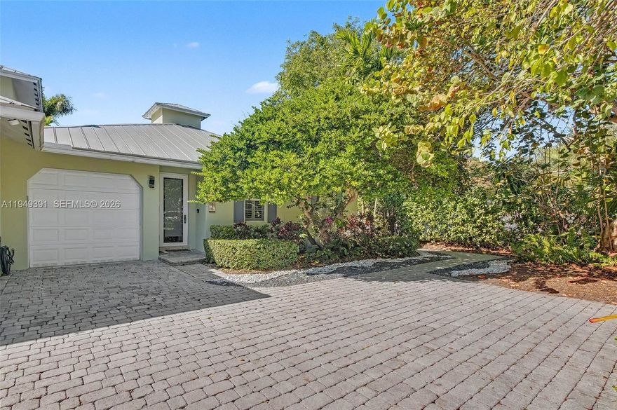 Exceptional, 2004-built, one-story, 3 bdrm/ 2 bath attached townhome style villa in North Pinecrest. Thoughtful upgrades include impact windows/doors, metal roof & full home generator. Lovely, open living area w/ updated kitchen featuring white cabinetry, white leathered marble countertops, luxury brand appliances, center island & dining area overlooking the backyard. Indoor laundry. Wonderfully appointed details; plantation shutters, beautiful millwork.  Marble flooring & 9ft ceilings. Delightful primary suite w/ walk in closet. Two additional guest bedrooms, one perfect for use as an office. Fantastic, fenced backyard includes heated pool w/ water feature, zen garden, ample lawn & privacy hedge. 1 car garage, paver driveway. No HOA. Close to shops and restaurants.