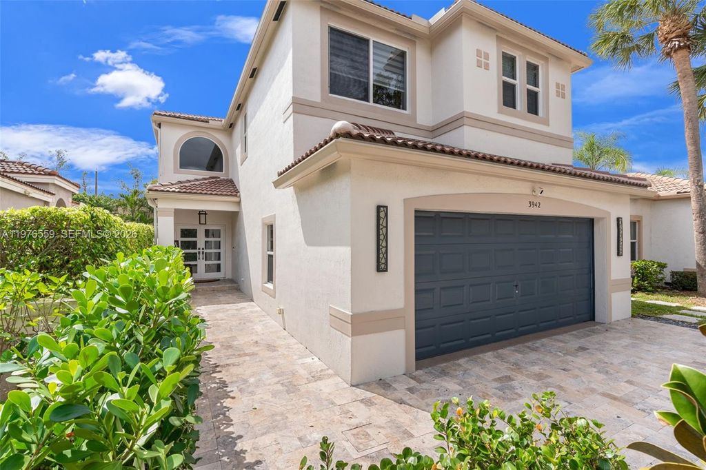 Photo of 3942 NW 62nd Ct, Coconut Creek, FL 33073 (MLS # A11976559)