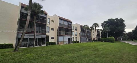 Photo of 8050 W Mcnab Rd #212, Tamarac, FL 33321 (MLS # A11894809)
