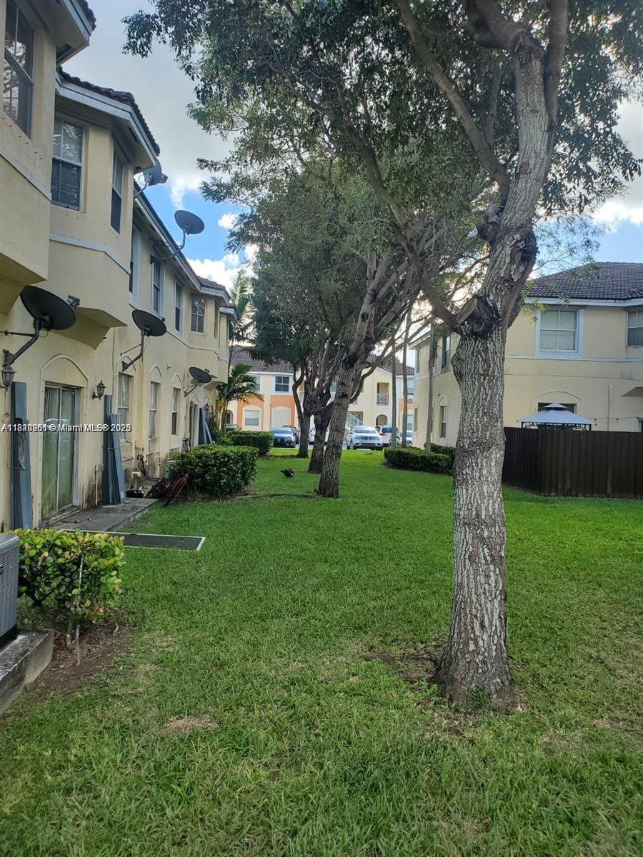 Spacious and bright unit in gated community. Great floor plan, lots of amenities, near shopping, schools & entrance to the Florida Keys. Parking in front of home. Gym, community pool and more.
