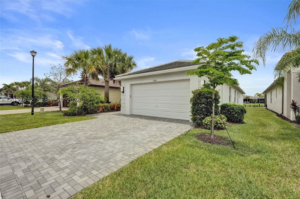 Photo of 13328 SW River Rock Rd, Port St Lucie, FL 34987 (MLS # A12037642)