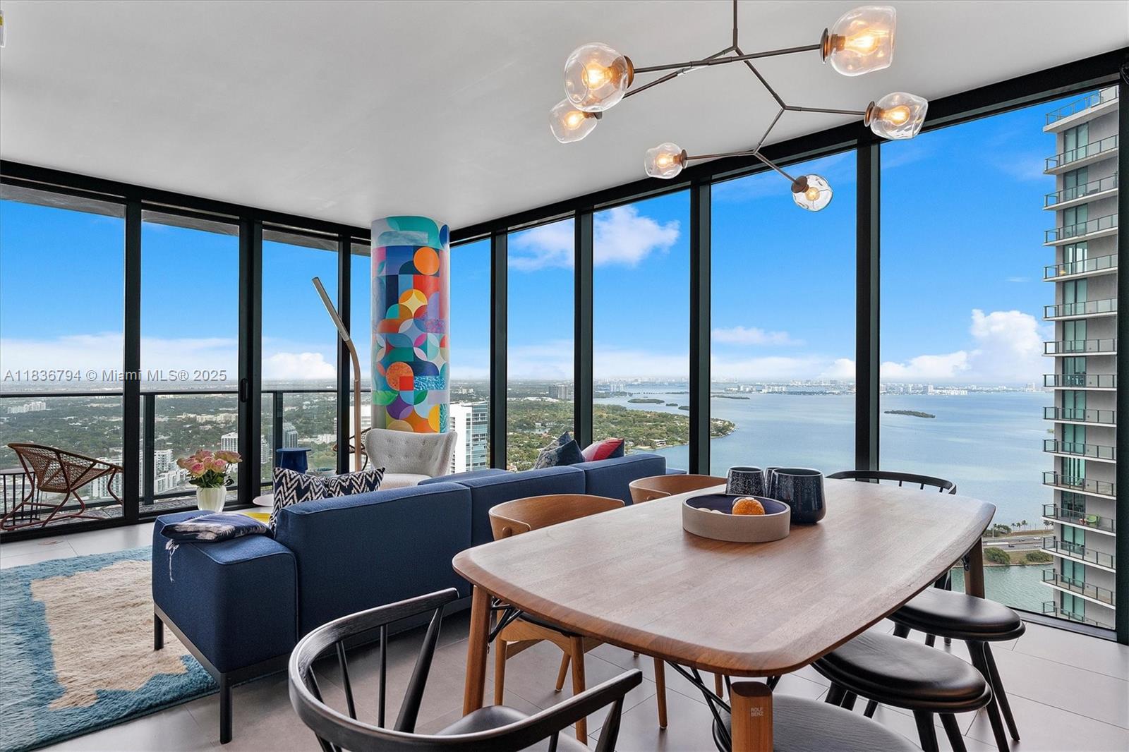 Stunning 1-bedroom, 1.5-bath residence at Paraiso Bay with spectacular bay and city views. This beautifully upgraded home features over $150K in custom finishes, including Ann Sacks tile, designer stonework, Italkraft cabinetry, and an integrated Wolf induction cooktop. Thoughtfully designed with a built-in desk, sculptural nightstands, a custom-painted column by artist Ronen Azulay, and fully built-out closets. Premium fixtures throughout, including Brizo faucets, Robern vanities, Duravit sinks, Buster + Punch hardware, and electric shades with blackout in the bedroom. Located in one of Edgewater’s premier buildings, Paraiso Bay offers luxury amenities including bayfront pools, spa, gym, tennis courts, game room, theater, marina access, and 24-hour concierge.