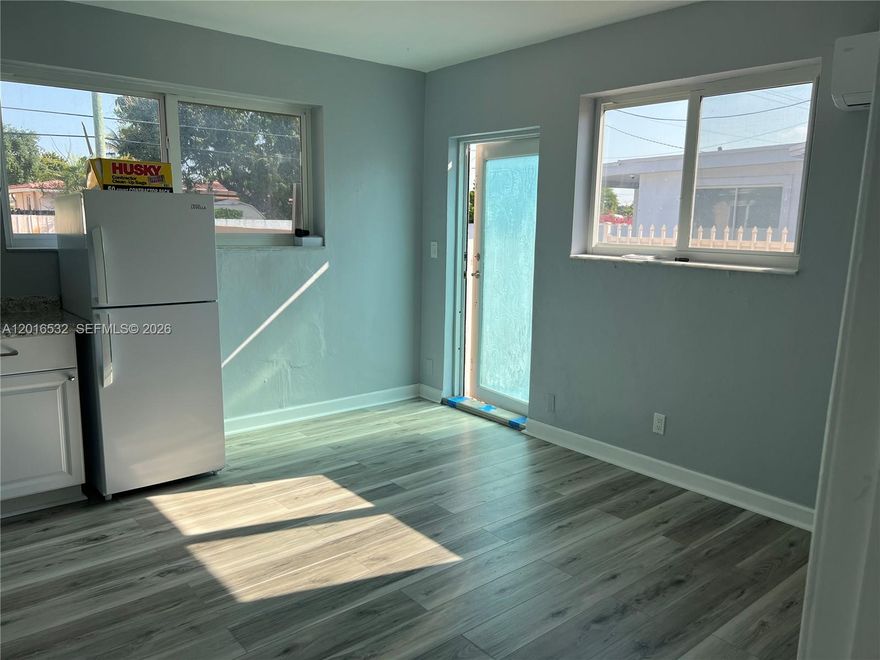 Beautifully remodeled efficiency in the heart of Hialeah featuring a separate bedroom for added privacy. This well-maintained unit offers a private entrance, spacious living area, and a large bathroom with walk-in shower. Enjoy the comfort of a dedicated A/C unit and the convenience of ALL utilities included—water, electricity, garbage, and Wi-Fi/Internet. The kitchenette is equipped with a full-size refrigerator, microwave, and portable stovetop. Ideal for 1 or 2 adults. Please note: no laundry on site and no backyard access. Small pets under 20 lbs allowed with a $200 pet deposit non-refundable. The entrance is privately fenced, adding extra privacy and security. Parking available for only 1 vehicle. Absolutely NO SMOKING permitted. This cozy unit is perfect for someone seeking a clean, comfortable, and private space in a central Hialeah location close to shops, dining, and major roads.