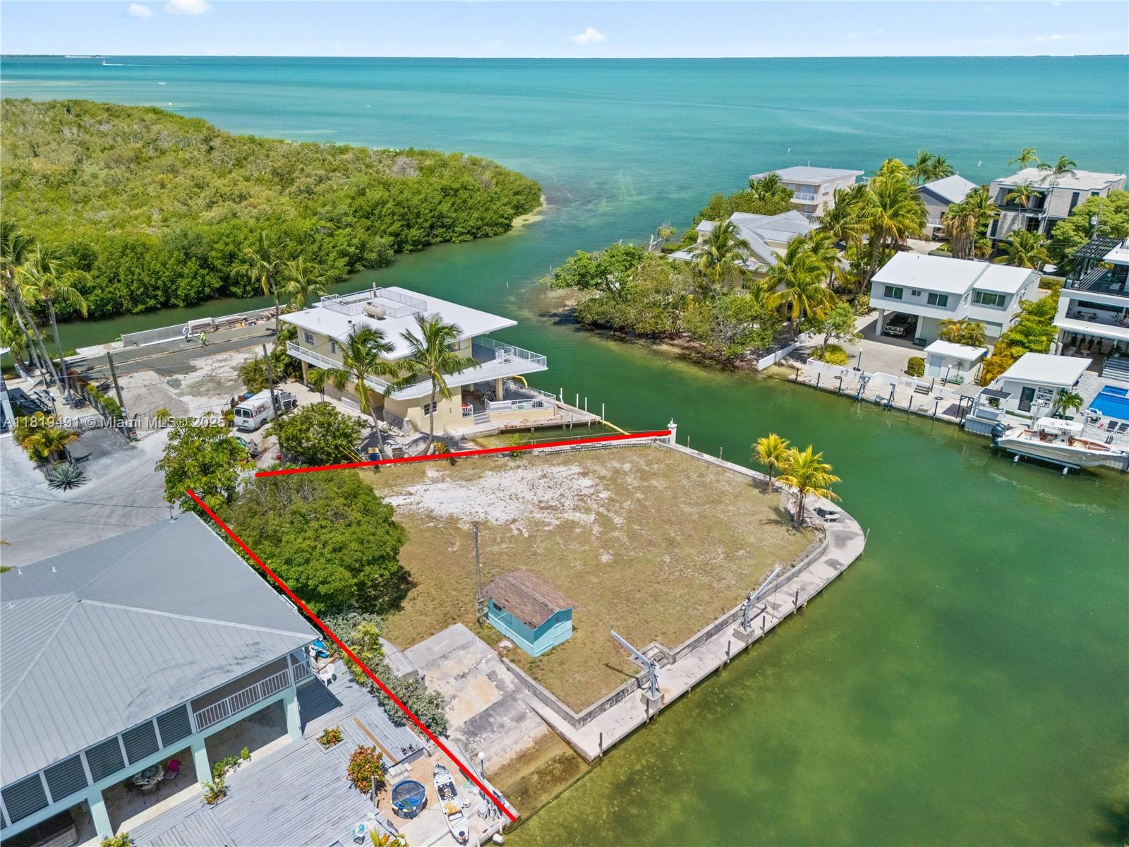 A Rare Slice of Paradise in Islamorada | 165' Concrete Dockage | Bay Views | 24 on BPAS List | Concrete Boat Ramp Discover one of the very few remaining oversized waterfront lots in prestigious Lower Matecumbe