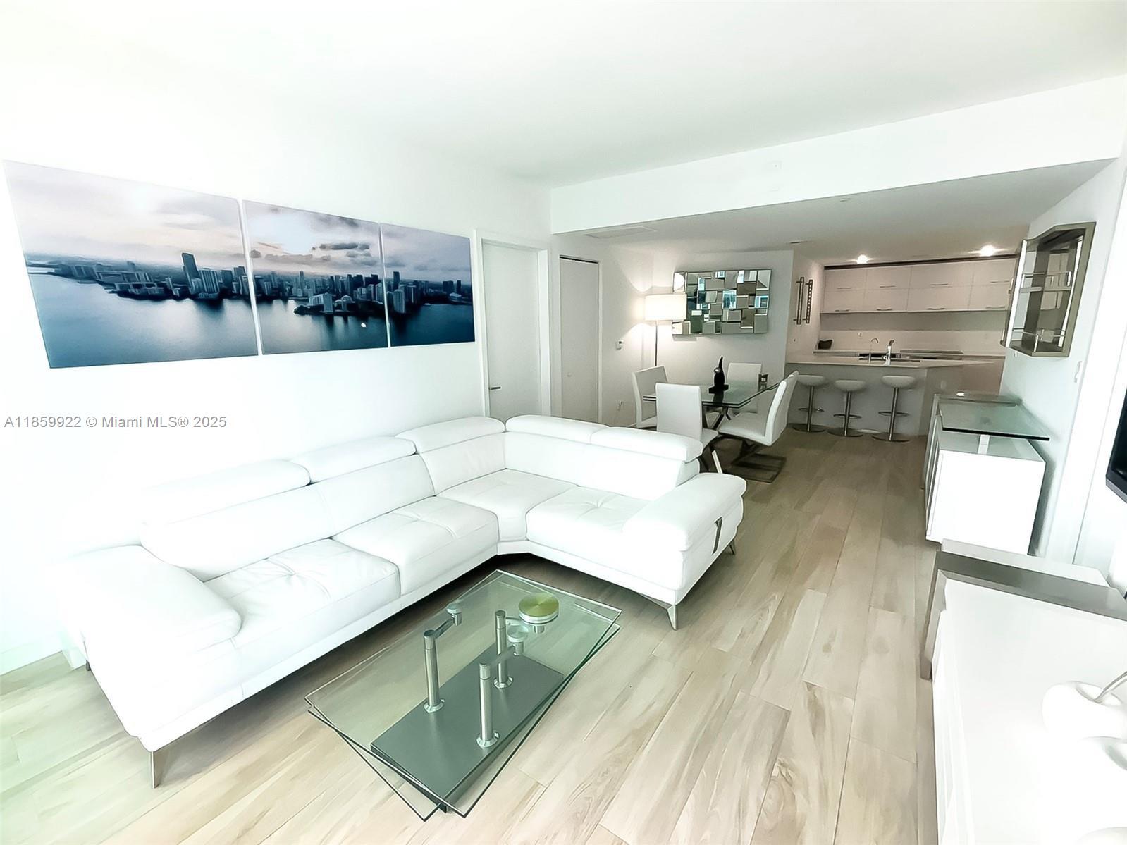 Discover the height of luxury living at DUA Miami! This stunning furnished 2-bedroom, 2.5 bathroom residence, complete with one assigned parking space, offers 961 square feet of living space and breathtaking city/bay views. Ideally located within walking distance to Brickell City Centre, Mary Brickell Village, and some of the finest dining options in the city, this building caters to both professionals and families, making it an excellent choice for remote work. Brickell SLS (now DUA Brickell) provides an exceptional array of amenities, including 24/7 doorman/security, two pools with cabana service, an exclusive rooftop pool for owners/tenants with panoramic views, a jacuzzi, spa, fitness center, and valet parking for guests.