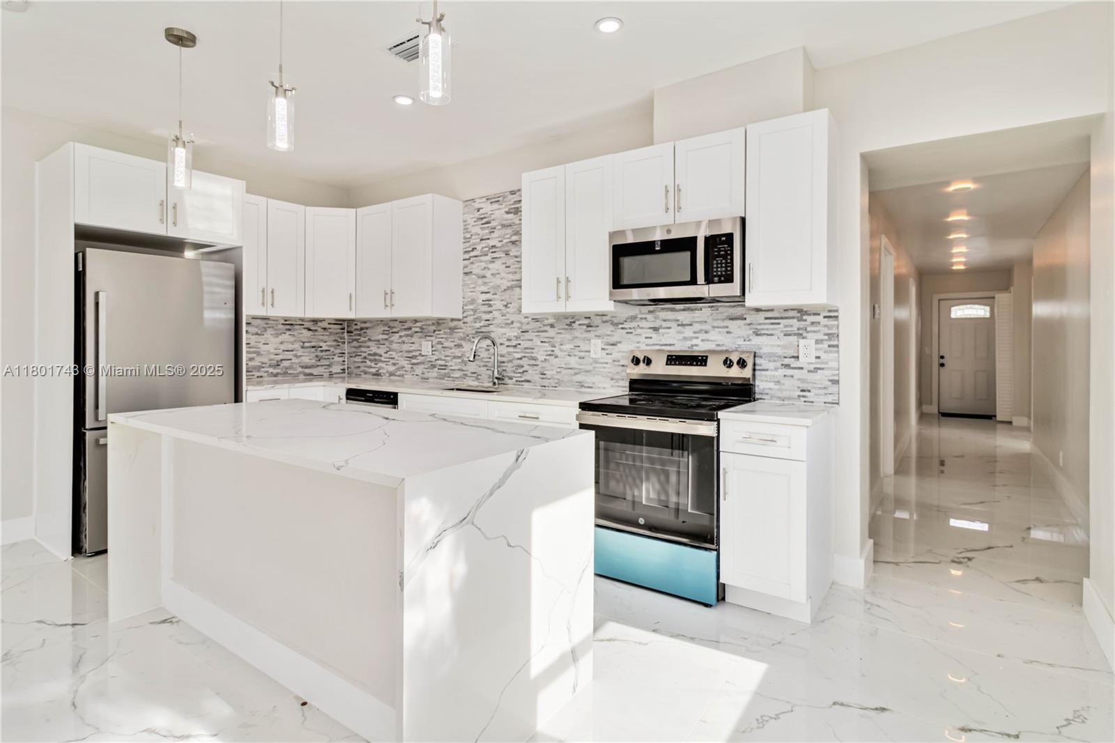 Fully updated 3bed 2bath home, no HOA fees. Located just minutes from the beach and all the vibrant shopping, dining, and entertainment options Lake Worth has to offer. No rental restrictions, this property is a turnkey income generator, perfect for short-term rental platforms like Airbnb or seasonal leasing. Interior features include a stylish modern kitchen with quartz countertops, stainless steel appliances, and a central island, along with fully renovated bathrooms, impact-rated windows and doors for enhanced security and sound reduction, and a recently installed 2021 roof. The spacious private lot offers excellent potential for a full privacy fence, outdoor entertaining areas, and even the addition of a plunge pool or spa to significantly boost rental income and property value.