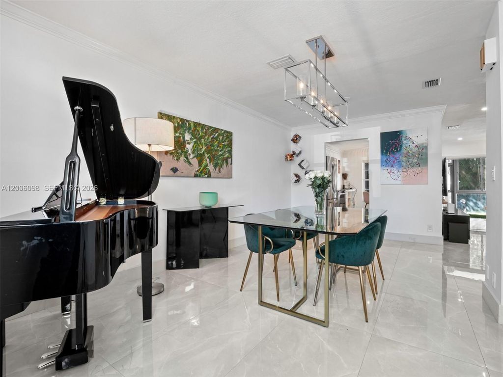 Photo of 2553 NW 42nd Ave, Coconut Creek, FL 33066 (MLS # A12006098)