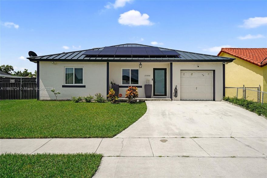 Located just minutes from the Turnpike and 216th Street, this beautiful property offers both comfort and convenience. It features a durable aluminum roof, elegant ceramic tile flooring, and a completely remodeled kitchen with wood cabinetry and stunning quartz countertops. Roof was installed in 2020 and A/C is just about one year old.