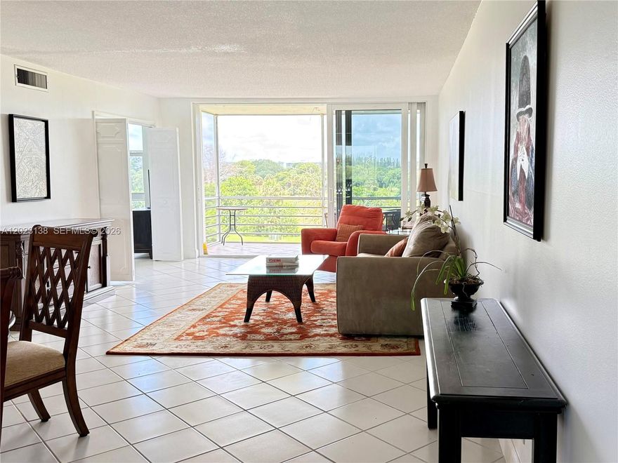 Bright and beautifully maintained 2-bedroom, 2-bath condo located in the desirable Palm Aire community! Enjoy stunning golf course views from the large screened-in balcony, perfect for relaxing or entertaining. This spacious unit features all-impact windows and doors, new a/c units, generously sized bedrooms, and walk in large closets, offering ample storage throughout. Situated in an all-age community, the condo is directly across from the clubhouse, which features two large swimming pools, a common room, a terrace with 6 BBQ grills, and shuffleboard courts. Conveniently located near shopping, dining, and major highways — South Florida living at its best!