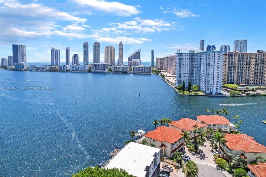 Waterfront elegance meets modern comfort in this Open Bay residence with private pool and two-car garage. This 3-bedroom + den, 3.5-bath home features soaring ceilings, expansive living areas, and an in-unit elevator. The primary suite offers dual walk-in closets, while each guest room includes an en-suite bath. Enjoy an open kitchen, stunning water-view dining, and seamless indoor-outdoor flow. Additional den/service room offers flexible use. Located in gated Eastern Shores with no fixed bridges to the ocean. Minutes to Bal Harbour, Aventura Mall, and Sunny Isles. Live the lifestyle you deserve.