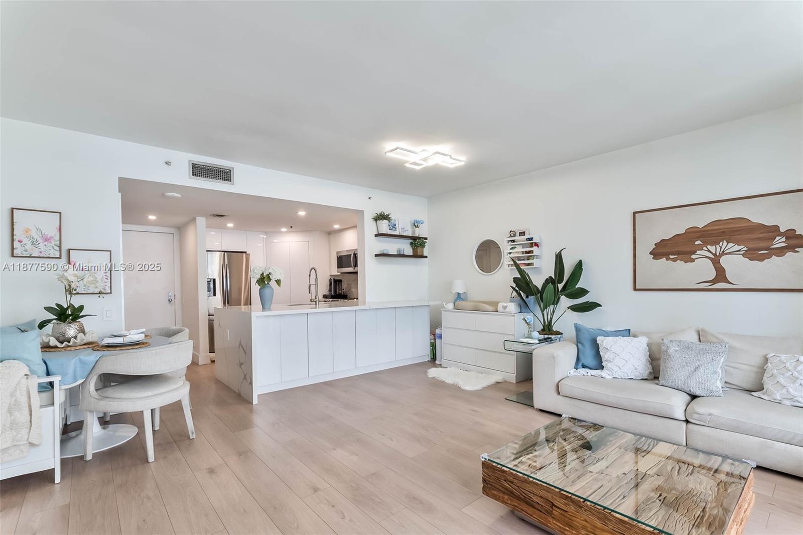 New Listing Alert! Discover your dream 1-bedroom, 1.5-bath apartment on Brickell Key! This fully remodeled gem boasts an open-concept living space bathed in natural light, offering stunning views of Biscayne Bay and the Brickell skyline—perfect for entertaining! The spacious primary bedroom includes a king bed, two nightstands, and features two custom closets for ample storage. Enjoy high-end finishes like sleek shaker doors, elegant vinyl wood-like floors, and modern quartz countertops. Additional perks include a brand new AC unit, appliances and washer/dryer. Building has also undergone recent upgrades such as new elevators, a business room, and a remodeled pool area. Come experience your new oasis!