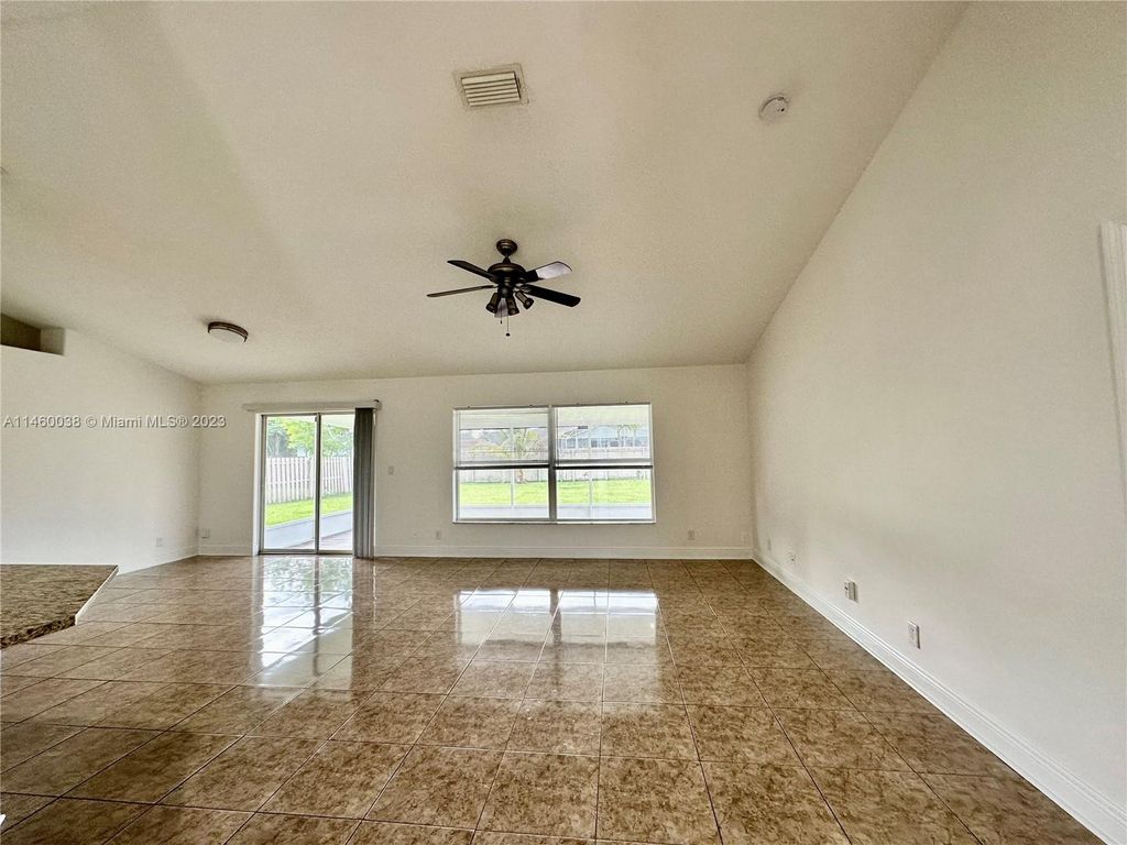 Photo of 990 SW Versailles Ave, Port Saint Lucie, FL 34953 (MLS # A11460038)