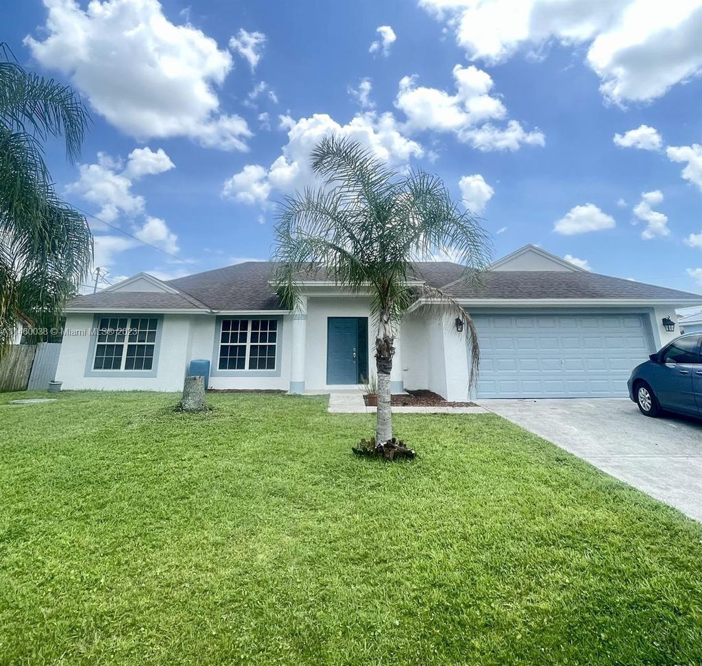 Photo of 990 SW Versailles Ave, Port Saint Lucie, FL 34953 (MLS # A11460038)