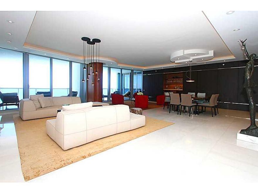 Spectacularly finished, contemporary double unit w/ direct ocean & city views. Imported white Himalayan Marble throughout, Media room, wet bar, top-of-the-line kitchen, 2 Sub-Zero refrigerators. Double Master Suites w/direct ocean views, walk-in closets,  large bathrooms, large terraces. Convertible library to bedroom. Lutron systems, 4 parking spots, private elevator. Amenities: fitness center, spa, party room, valet, movie theater, & beach service. Unit comes w/ 2 Storage Units. Furniture negotiable!