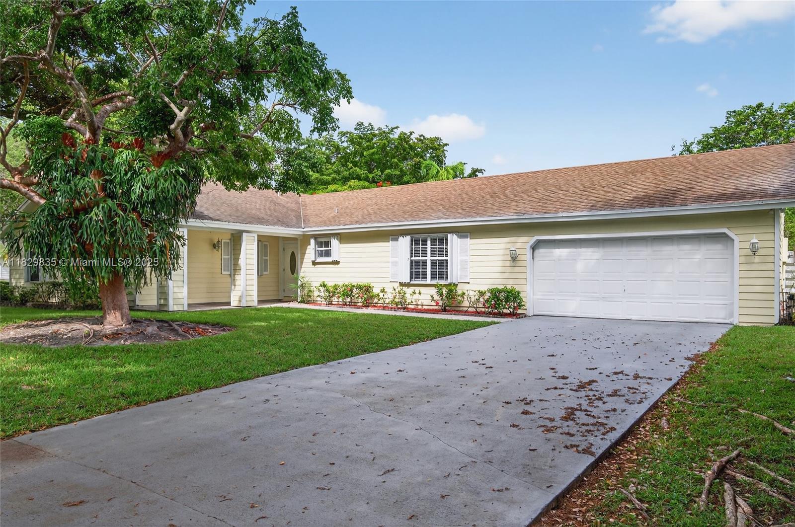 You will find this terrific Country Walk Estate home on the corner of a beautiful, lushly landscaped cul-de-sac. 4 bedrms, 2 bath, large primary with huge closet, double sinks and separate shower. Very neutral waterproof laminate with vinyl backing in all bedrooms plus living room. Tiled family room/lkitchen. Remodeled kitchen, new AC and flooring in 2023/24. Open kitchen with lots of wooden cabinets, spacious island, pantry and organizers, corian counters. All stainless steel appl. Separate laundry room. 2 car garage.Exterior with Hardy boards. Large driveway. Back yard with Avocado tree and 5 banana trees.Close to elementary school and a great Country Wal Community Center, tennis, sparkling pool, clubhouse, play area, and so much more. Roving patrol.Separate laundry rm large drive way.
