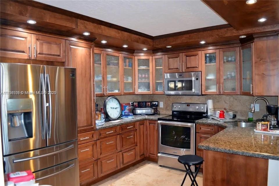 Beautiful condo totally upgraded with maple wood cabinets in kitchen,all stainless steel appliances, totally upgraded bathrooms. Very bright and airy with beautiful city views open balcony.Must see, close to Ft Lauderdale airport and beaches. This community has it all, 3 Pools,clubhouse with billard room,bowling alleys and more. This one is a steal for that price, 55 and older community. Very Quiet area. Has security patrol.