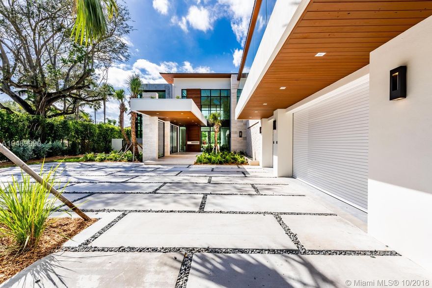 REDUCED BY $1MM from original price! Stunning brand new contemporary private residence built on oversized lot of 1.29 acres in one of South Miami’s most exclusive neighborhoods available NOW. 7 bedrooms , 7 bathrooms + powder room totaling ~10,700 sq ft with no expense spared. Separate guesthouse with bedroom and full bath.
Residence features 28 ft ceilings, top-of-the-line materials and custom finishes throughout, private elevator, 2 expansive family rooms, 3 car garage, state of the art MiaCucina kitchen, Sub-Zeros,grand outdoor space with heated infinity pool / spa for relaxing nights, outdoor summer kitchen, private outdoor terrace in master with glass railing, SmartHome and so much more. Close to Miami's best schools and South Miami and Dadeland Mall. MOTIVATED SELLER!