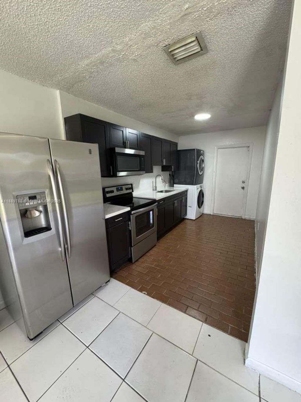 Photo of 2710 NW 11th Pl #1-2, Fort Lauderdale, FL 33311 (MLS # A11889788)