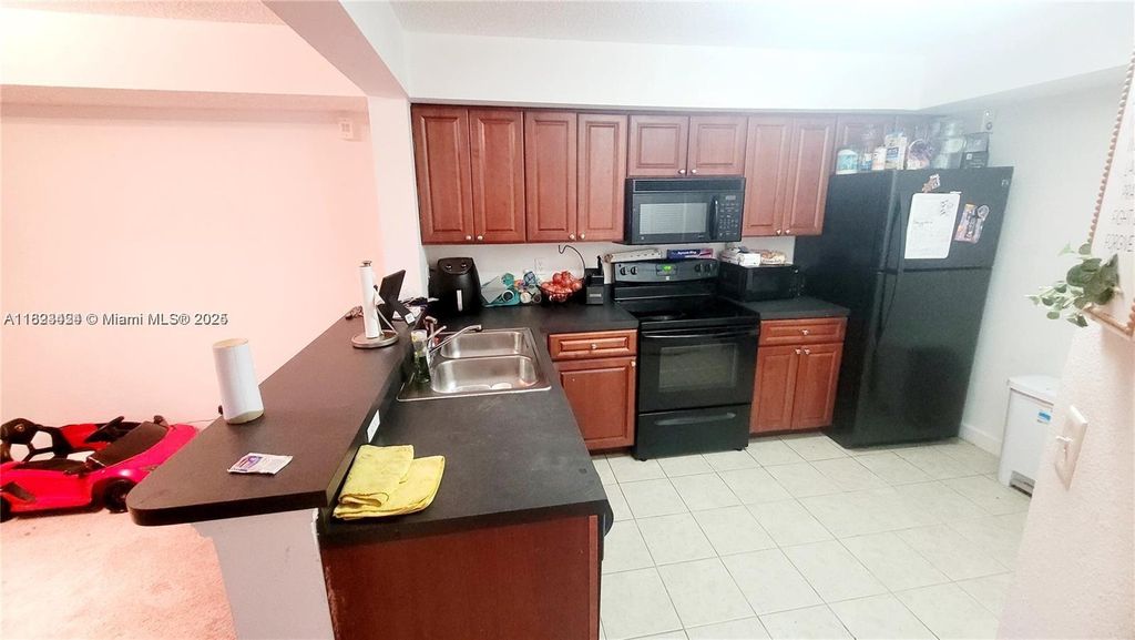 Photo of 10105 W Sunrise Blvd #205, Plantation, FL 33322 (MLS # A11823424)