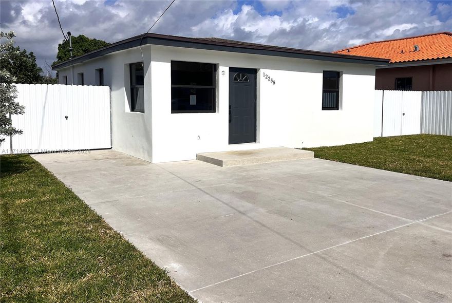 Just move in! Totally redone. New, New, New, down to the concrete blocks!  Be the first to live in this three bedroom one bathroom home. New drywall, roof, windows, A/C, electrical, electric water heater, be the first to hang a painting on these walls.  The kitchen is designed with white cabinets and quartz counter.  The home sits on a very large lot prime for entertaining with plenty of space for you to build a pool.  All the windows are impact. The plenty of parking spaces. The appliance will be installed once under contract. A terrace roof is also being installed for outdoor entertaining.
