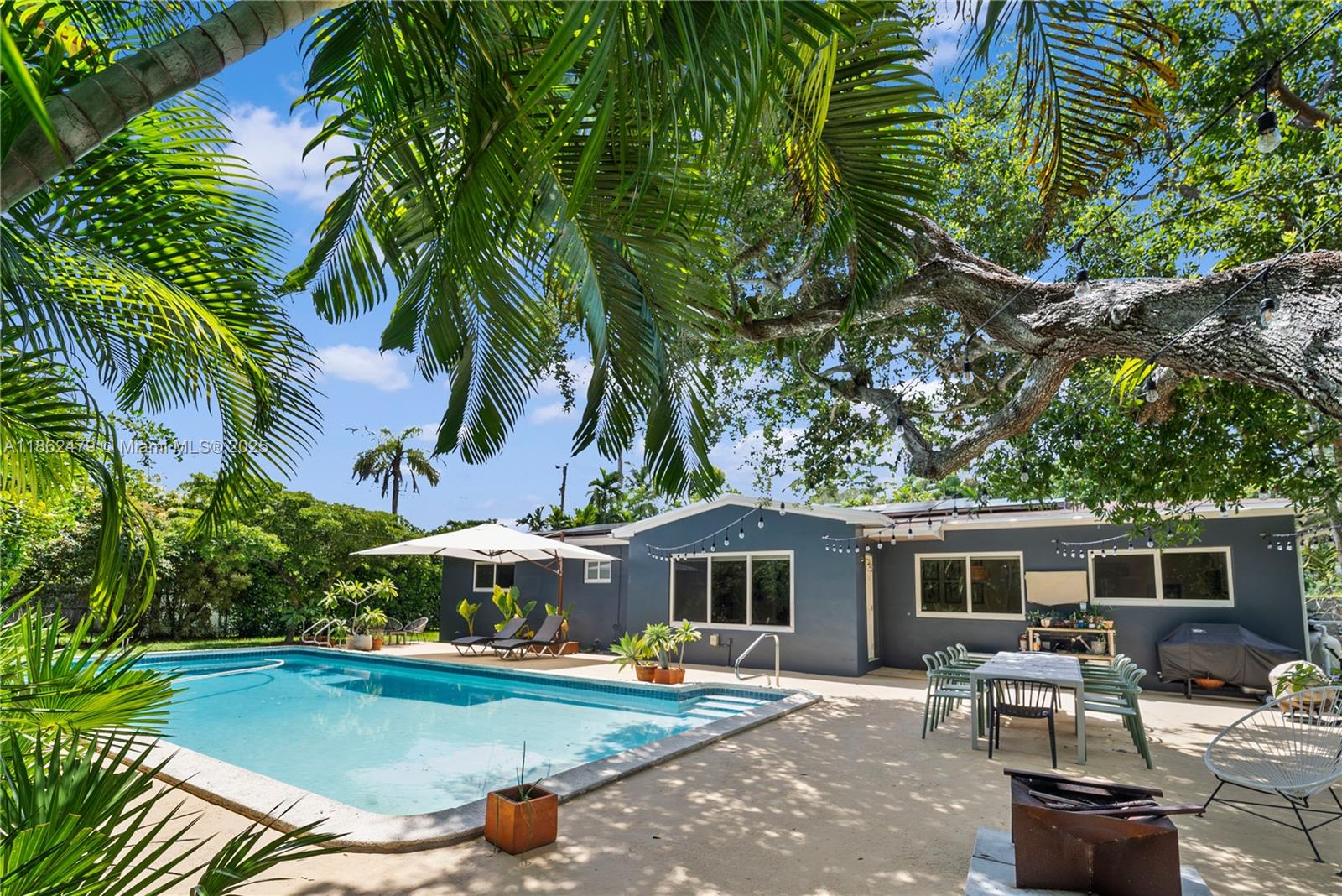Welcome to your Solar Oasis in the heart of South Miami, where timeless Florida living meets modern innovation. This charming single-family home checks all the boxes for a family: bright, welcoming interiors, a fully remodeled kitchen with premium LG appliances, and a seamless flow into the outdoors. The incredible backyard is a true retreat, featuring a sparkling saltwater pool and lush space curated for entertaining all of your guests. Behind the charm, the home is equipped with cutting-edge upgrades including a 10.8 kWh solar system, EV-ready setup, CGI impact windows and generator transfer switch, blending efficiency and peace of mind with everyday comfort. A rare mix of character and technology, this home elevates Miami living to a whole new level.