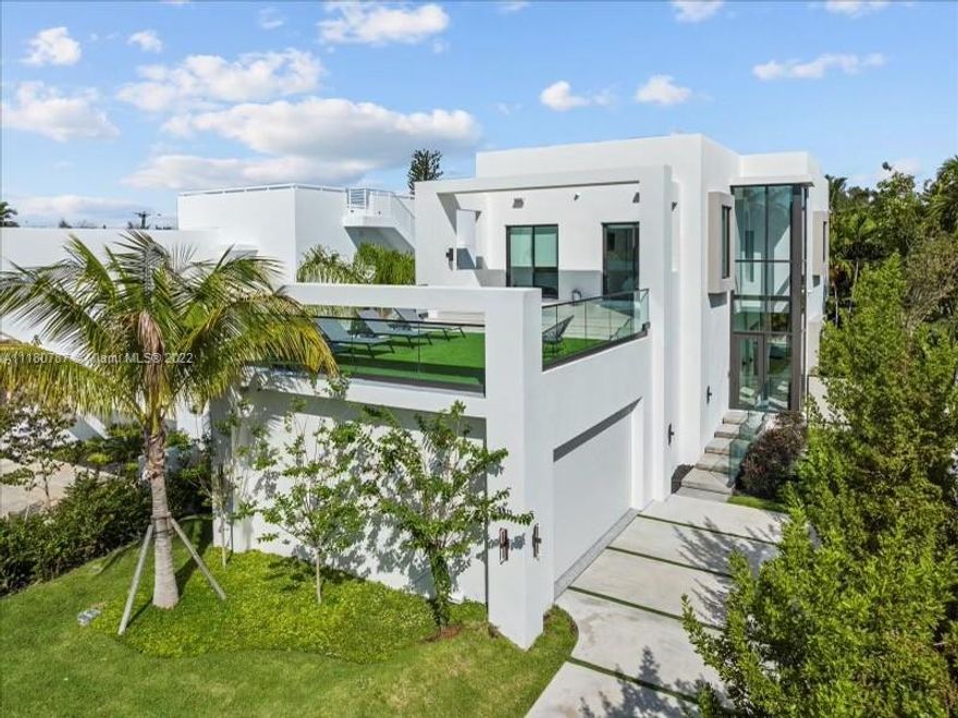 NEWLY COMPLETED 2022 Miami Beach masterpiece nestled on prestigious Bay Dr. No expenses spared, with 5 beds & 5.5 baths of seamless living, spread across 2 stories. Loaded w/energy efficient & sustainable features such as high elevation, double-pane impact windows, high-efficiency AC, LED lighting, induction cooktop & more. Great for car aficionados, the 11' height garage can accommodate lifts to park 4 cars. This fully automated smart home has state of the art security, technology & finishes including:  Sonos indoor-outdoor entertainment, security & surveillance, Bosch appliances, Italian doors & kitchen by Nobilia. An entertainer's dream home with infinity pool on ground level & expansive terrace on 2nd level. Fully furnished allowing for turnkey experience, just bring your toothbrush!