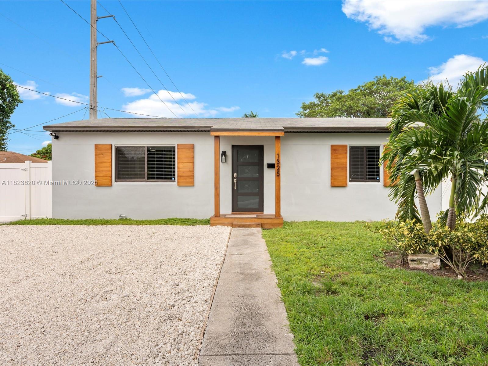 Charming 3BR/1BA home perfectly located in East Hollywood, just under 3 miles from the beach and minutes to shops, restaurants, and family-friendly attractions. This well-kept property features a modern kitchen with granite counters and stainless steel appliances, updated bath, and full hurricane protection. Nestled on a spacious 6,629 sq ft lot, this gem offers a perfect blend of indoor charm and outdoor functionality. Enjoy a spacious, fully fenced backyard—ideal for entertaining, relaxing, or storing a boat/RV—with a remote-controlled side gate for added convenience. Additional highlights include a newer roof (2022), whole-home water filtration system, and no HOA. A fantastic move-in-ready home or investment opportunity in a prime location!