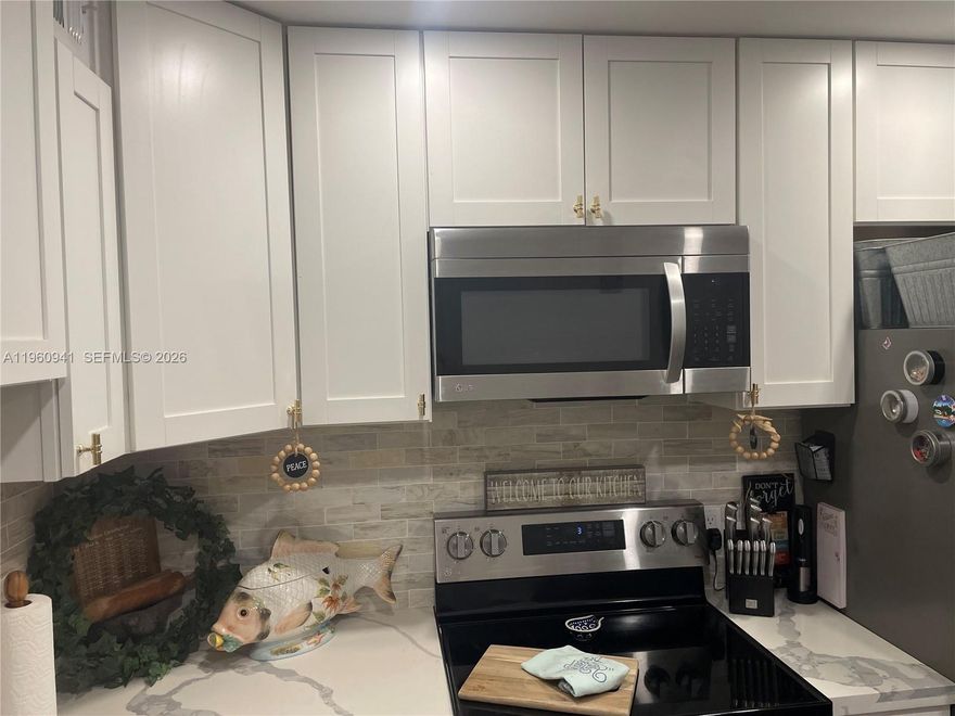 BEAUTIFUL Waterfront 2/2 APARTMENT on 3RD floor. Complete remodel encompassing a new kitchen & bathrooms, an enclosed balcony.