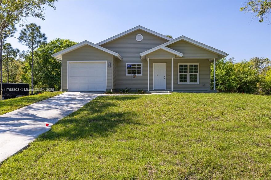 Energy-Efficient Modern Home with Incredible Value ~ New construction Structall "Camden" model featuring revolutionary SIPS technology for maximum energy efficiency. This spacious 3 bed/2 bath+ den home boasts 15.5-foot vaulted ceilings, PGT impact windows,& a fully insulated high-performance garage. Interior highlights include luxury vinyl flooring throughout, gourmet kitchen with quartz countertops, stainless appliances, and 42-inch soft-close cabinetry. Strategically elevated at 26.1 feet above sea level ~no flood insurance. Generous extra lot perfect for pool or additional structures. Experience next-generation living w/cutting-edge construction, superior energy efficiency (17.5 SEER HVAC with heat pump), and exceptional design that represents the future of smart home living.