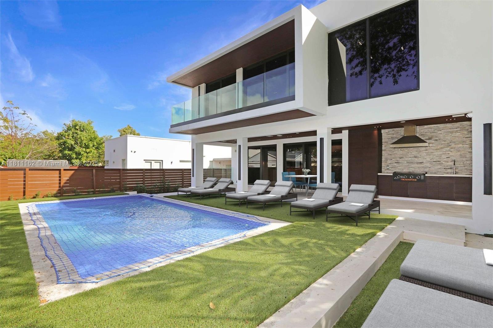 Brand new modern masterpiece in the highly sought after neighborhood "The Roads", steps away from Miami's best shopping & restaurants. Pull into your gated Driveway featuring recessed inground lighting, surrounded by a lush garden & Space for up-to 4 cars + garage. Enter through a grand pivot door into an open layout with impeccable attention to detail, this two story home spans 3,500 sqft with 4 bedrooms & 5 full bathrooms. Trimless doors & recessed linear lighting for a seamless look throughout the home. Beautifully designed kitchen with top end Bosch appliances & custom wet bar. All ensuite bedrooms w/ built out closets & luxurious bathrooms, featuring Brizo hardware & custom vanities. Spacious terrace with built out summer Kitchen, pool & full cabana bathroom. Full security system.
