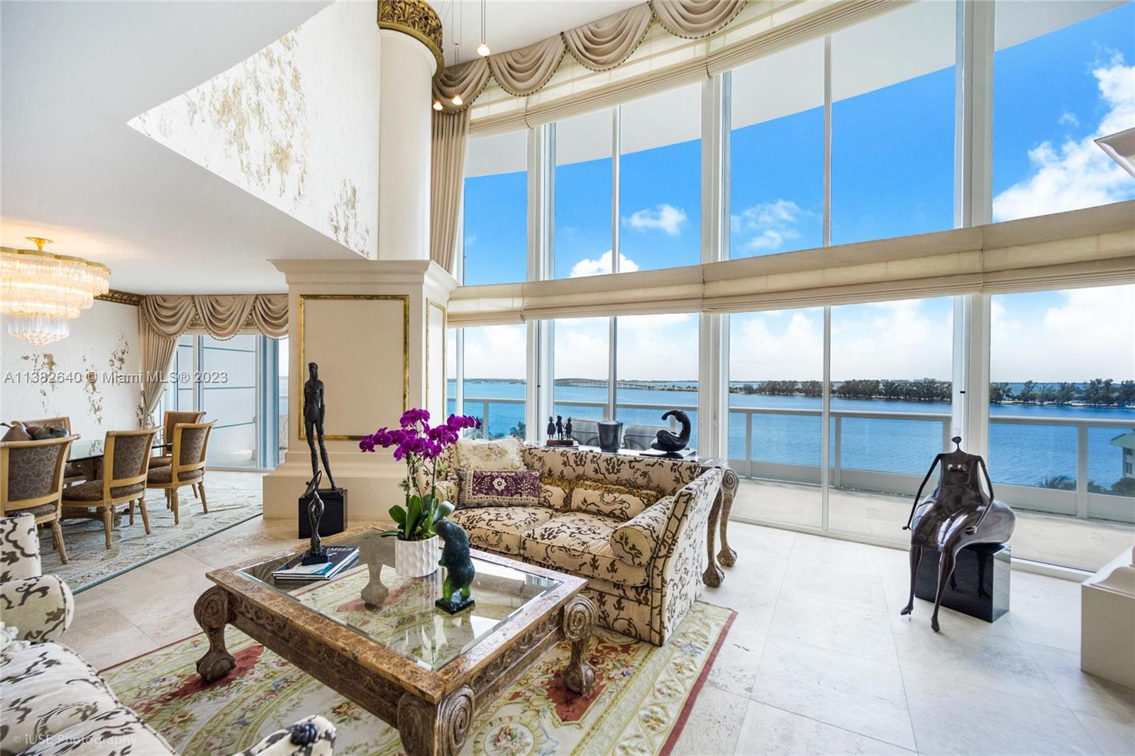 No expense has been spared in this meticulously cared for, one of a kind two-story 2 + Den/2.5 Bath masterpiece in coveted Bristol Tower. One of only 7 units with this generous floor plan, luxurious details abound in this inspired retreat: Custom-finished walls, ceilings, tile-work & crown moldings; upgraded bathrooms with Sherle Wagner faucets & custom shower doors, imported handmade carpeting, Murano crystals, Swarovski light fixtures, solid wood doors w/special accents & hinges, custom closets, electric curtains, as well as Miele & Sub-Zero appliances, to name a few. Gorgeous unobstructed bay views provide a sense of privacy & escape. A rare one-owner property, this pristine home, with its expansive living area, soaring ceilings & 3 balconies, is reminiscent of a seaside Italian villa.