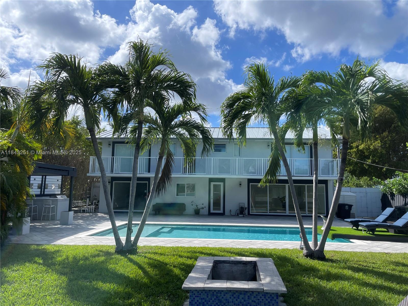 2 story waterfront home in guard-gated community of San Souci Estates is for rent! This Waterfront Home is ready for you and your family to have fun all year round in Sunny Florida. Features 4 bedrooms, 3 bathrooms . Eat-in kitchen overlooking pool and water, and an open floor plan. Direct ocean access in to the Bay with no fixed bridges Over 75 feet of waterfront. included dock for your yacht up to 70 Ft and jet ski . Retreat upstairs to the expansive second-floor huge master suite, featuring a private open terrace overlooking the stunning water views. This home offers very nice backyard, complete with a covered barbecue area, a sparkling pool, a sun deck. All windows and doors are impact resistant. Circular Driveway , can park up to 6 cars .