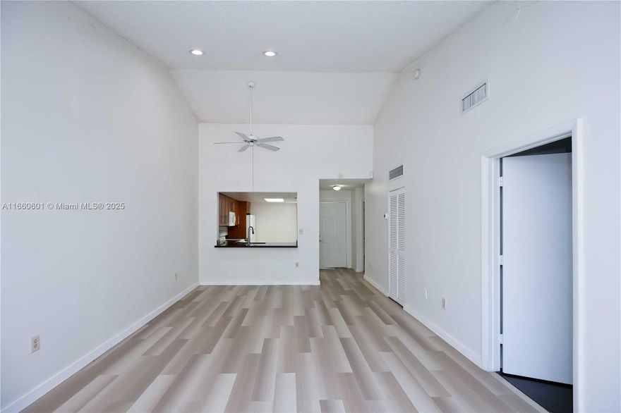Spacious 2-bed, 2-bath apartment on the second floor with vaulted ceilings, creating a roomy and open feel. Located in a gated community, walking distance to Pembroke Lakes Mall, shopping centers, and elementary school. Features an updated kitchen with granite countertops, laminate flooring, in-unit washer and dryer, and 2 assigned parking spaces. Community amenities include a clubhouse, children’s playground, pool, and tennis court. View the community pool and playground from your balcony.  Ideal for comfortable, convenient living!