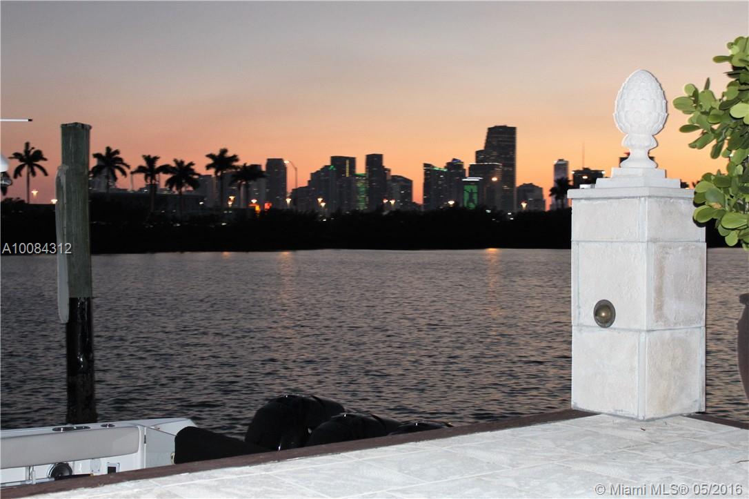Beautiful Mediterranean home on Palm Island offering striking Miami skyline views. This 4,546 SF home is situated on a 7,000 SF lot with 50 feet of WF, dock, & pool with a deck for entertaining & sunbathing. Open floor plan for a spacious feel, 3 beds including master on the 2nd floor & 1 bed on the 1st floor. Renovated master bath w/steam shower, water purifying system, & Pebble tile floors. Guard-gated Palm Island has a park with a playground, tennis, basketball, & racquetball courts. SF per appraisal.
