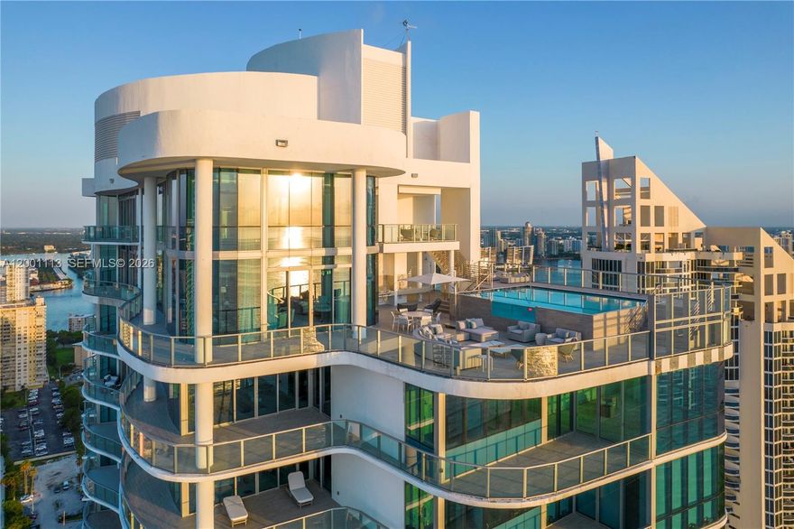 A trophy duplex penthouse defined by sweeping horizons, grand scale, and total privacy above the coastline.

Occupying the 32nd and 33rd floors of Chateau Beach Residences, this fully furnished residence spans over 9,000 square feet, with four bedrooms, five full bathrooms, and three half bath. Floor-to-ceiling glass surrounds the living spaces, capturing sweeping views of the Atlantic Ocean, Intracoastal Waterway, and the skylines of Miami and Fort Lauderdale. A private in-residence elevator connects both levels, where expansive entertaining areas include a grand great room, formal and informal dining, and a media lounge.

The upper level is devoted to a private primary suite wing, designed as a retreat with a den, fitness area, dual walk-in closets, and a spa-caliber bath complete with sauna and wellness spaces. Interiors are curated with bespoke millwork, statement lighting, and designer furnishings, delivering a cohesive, elevated finish.

A 4,523-square-foot wraparound terrace extends the living experience outdoors, offering multiple lounge and dining areas, an outdoor pool deck, and a private pool, all oriented to capture unobstructed water and city views. The residence is further complemented by four valet parking spaces.

Located within one of Sunny Isles Beach’s premier oceanfront buildings, residents enjoy direct beach access and a full suite of resort-style amenities in a setting defined by privacy and service.