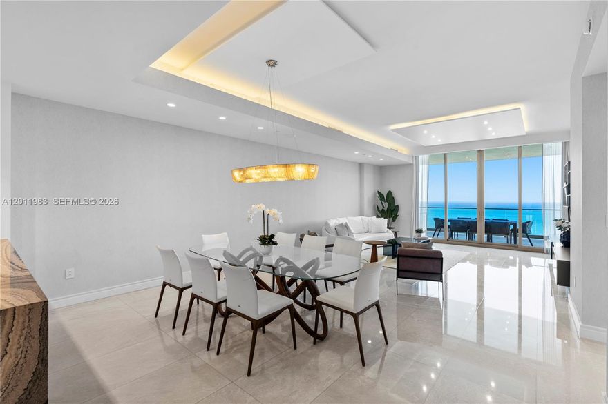 Experience the ultimate in luxury living at The Estates at Acqualina with this elegant Vecchio residence. This stunning 4bd/5bth home with a den/office featuring a custom Murphy bed offers flexibility to serve as an additional bedroom. Actual area per floor plan is 3,287 sq.ft. Enjoy direct ocean and city views, a private elevator foyer, and a sophisticated open layout with designer finishes throughout. Residents indulge in ultra luxury amenities including a private beach, multiple pools, world class spa, fitness center, golf simulator, ice-skating rink, bowling alley, and Rolls Royce house car service. Ideally located minutes from Bal Harbour Shops, Aventura Mall, and both Miami and Fort Lauderdale airports. Live every day like a 5 star resort experience.