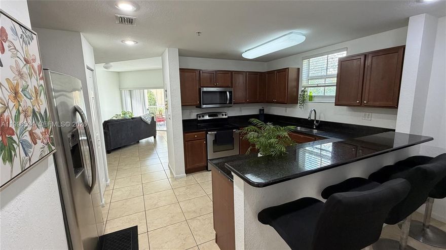 Rare corner unit with the largest floor plan available, offering 3 bedrooms, 2.5 bathrooms, and an additional enclosed flex space perfect for a home office or playroom. This light-filled home offers exceptional privacy, high ceilings, no carpet, spacious bedrooms, generous closets, attic storage, and a large private covered balcony with pea ceful green views. The oversized kitchen features granite countertops, stainless steel appliances, abundant cabinetry, and ample counter space, plus a separate laundry room. Enjoy resort-style amenities including clubhouse, pool, sports courts, walking paths, visitor parking, 2 parking spaces. Close to Dr Toni Bilbao Elementary School. Excellent location with quick access to the Florida Turnpike, shopping, dining, and everyday conveniences. If you are looking for size, functionality, and privacy, this is the one. Clubhouse ammenities here: https://www.thedoralclub.com/