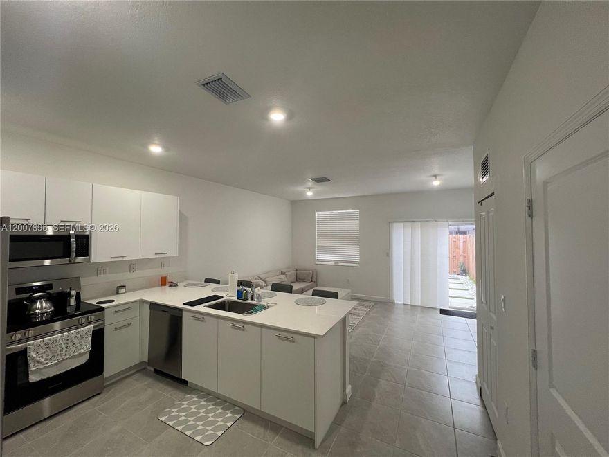 This new 3-bedroom, 2.5-bath modern townhouse opens with a versatile front nook perfect for a foyer or home office and flows into a bright open-concept living area anchored by a sleek white kitchen with quartz countertops, stainless-steel appliances, undermount sink, and a breakfast bar for four. Sliding glass doors lead to a private backyard oasis featuring concrete pavers set between faux-turf strips, framed by white river rocks and a wooden privacy fence — ideal for al fresco dining or evening relaxation.

Property rented through February 2027 with excellent tenants in place, making this a great turnkey investment opportunity. Seller willing to assist with a smooth transition.

Motivated seller — bring your best offer!