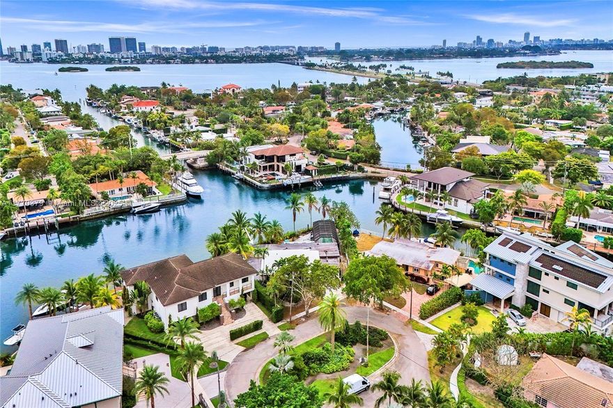 Truly One-of-a-Kind in Gated Keystone Point! 144ft 3 different Views of the Water! Located at the end of a quiet cul-de-sac on exclusive Hibiscus Circle, this extra-large 13,149 sq ft lot—nearly double the typical size—offers wide water views completely unique to the island. Set on one of the deepest and widest canals in Keystone Point, this rare property features a longer-than-average dock area, ideal for large yachts or multiple boats. Enjoy quick ocean access, just minutes to the open bay and close to Haulover Inlet. The southeast-facing backyard captures breathtaking sunrises and fills the property with natural light. Surrounded by new luxury construction, this is a prime opportunity to build your custom waterfront dream home in one of Miami’s most desirable neighborhoods.