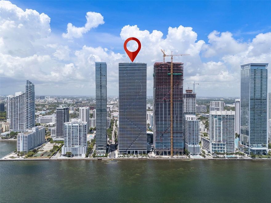 Priced to Sell! Luxury living at Aria Reserve South Tower in Miami’s Edgewater. This 1,783 sqft new construction residence offers private foyer, 2 bedrooms + den, ideal to be used as a 3rd bedroom or office, 3 full baths and 2 assigned garage parking spaces (the 2nd one valued a $100K included on the price). Enjoy 10-ft floor-to-ceiling impact windows with stunning Biscayne Bay & Ocean direct views, high-end finishes, open layout, and walk-in closets. Enjoy the resort-style amenities: semi-Olympic pool, fitness center, wine lounge, party room, courts for tennis, paddle, mini-golf, kids’ play area, cabanas, business center, and secured lobby. Minutes to Wynwood, Design District & Miami Beach. Access I-95, I-195, I-395 and Venetian Cswy within minutes.  SELLER FINANCING AVAILABLE!
