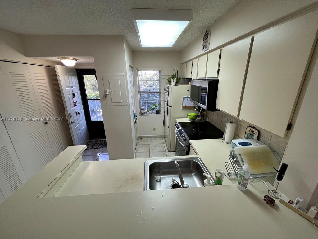 Photo of 2230 N Cypress Bend Dr #309, Pompano Beach, FL 33069 (MLS # A11478433)