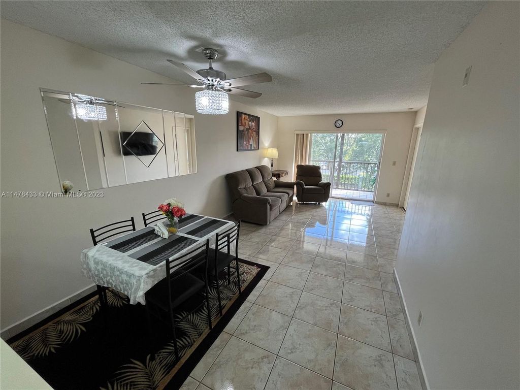 Photo of 2230 N Cypress Bend Dr #309, Pompano Beach, FL 33069 (MLS # A11478433)