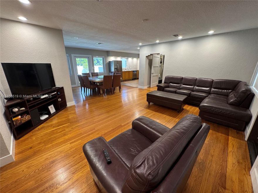 Just WOW!! Remodeled home,gorgeous wood floors, split bedrooms (large), open concept for ease of entertaining and living! ALL windows-HURRICANE IMPACT GLASS! 
      PRICE REDUCED-CONTACT AGENT TO VIEW HOME!
See all photos! So many extras...  The most GORGEOUS POOL, large yard for entertaining! Completely fenced with privacy wall! Double garage used as work shop + carport. Roof only 10 yrs old. Sturdy metal fence and gate to property in front. Natural gas on street offers possibilities-gas hot water tank, gas cooktop on stove, elect. oven, see photos! House is fantastic! 3 blks N. of Hollywood Cir! Ready for families, entertaining, and close to parks, schools, beach, fresh markets, and shopping! OK to rent, no HOA. Walkable neighborhood. CALL Listing agent to show, owner occupied.