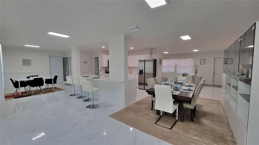Beautiful 3-bedroom, 2-bathroom unit with 1,700 sqft, featuring a private terrace and convenient elevator access, just 5 to 9 minutes from the beach! Enjoy the convenience of walking to Gulfstream Park Racing and Casino and being only 10 minutes from Aventura Mall. This upgraded unit offers exceptional value with porcelanato flooring, elegant base and crown molding, and renovated bathrooms featuring glass shower doors and quartz countertops. The remodeled kitchen includes white cabinetry, quartz counters with an island, and stainless steel appliances. Additional highlights: in-unit washer/dryer, spacious third bedroom with closet, impact windows, and recessed LED lighting. Located in a 55+ community with building renovations planned by the association. Don’t miss this opportunity!