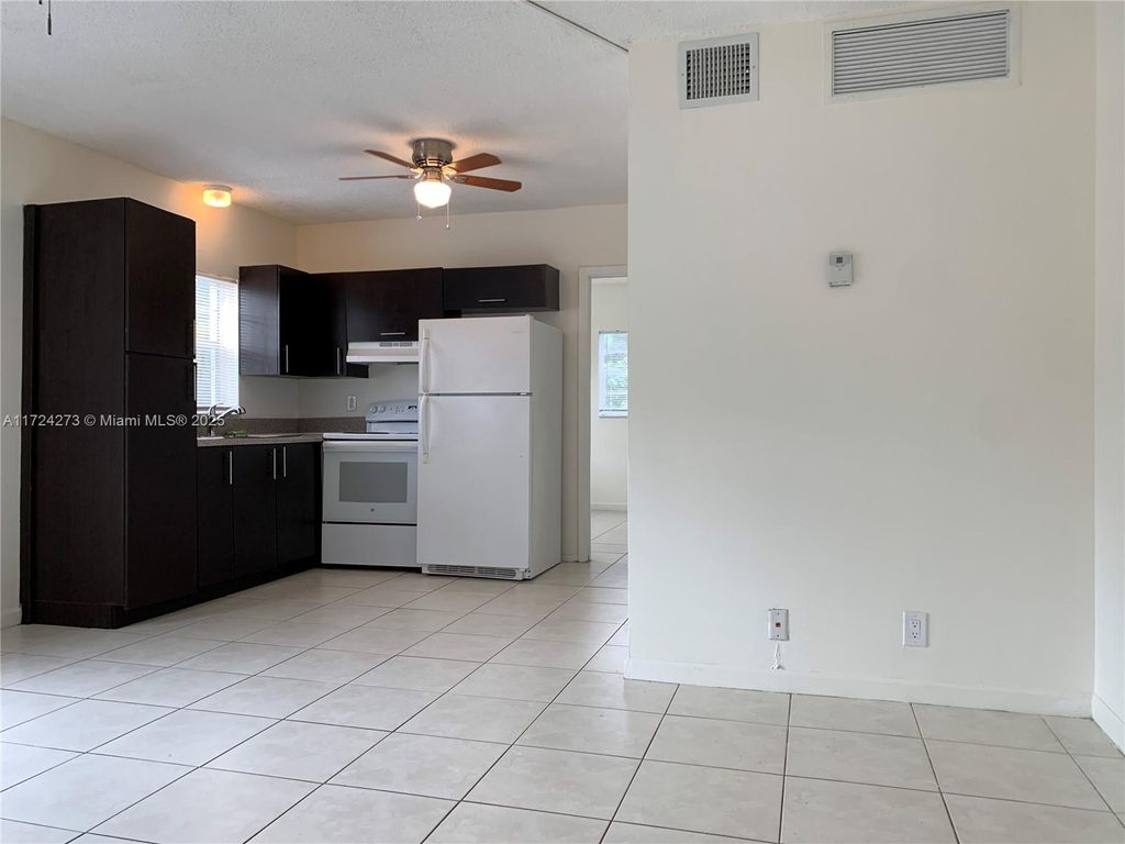 Photo of 4140 Woodside Dr #101, Coral Springs, FL 33065 (MLS # A11724273)