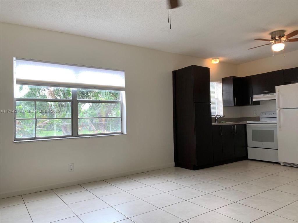 Photo of 4140 Woodside Dr #101, Coral Springs, FL 33065 (MLS # A11724273)