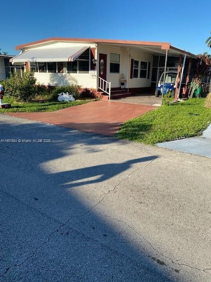 Beautifully upgraded home, furnished all equiped, 2 Bedroom, 2 full Bathroom, design upgraded kitchen, open to dining/living area, french doors to sun room, lots of windows, for more natural light, lots of closets storage, ceramic tiles in kitchen & both Bathrooms, all other rooms upgraded laminated floor,  sits on a 4,000 sq.ft.lot, own the Land! Back yard canal view, storage shed, large patio, deck floor with composite plastic planks, bar counter with 3 high bar stool, BBQ. low HOA fees $139 mo. Community offers 3 Club Houses, 3 Heated Pools, Library, Shuffleboard and lot more of Activities.