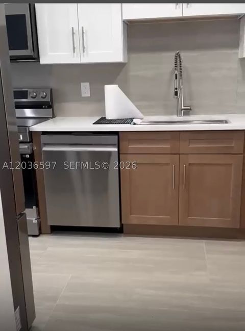Photo of 2940 N Course Dr #311, Pompano Beach, FL 33069 (MLS # A12036597)