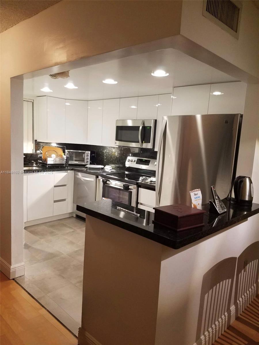 For Rent Largest 1 bedroom in Fontainebleau available. 1125 Sq ft 2 level 1 bedroom 1.5 bath condo at the Beach Club. Features an updated Kitchen, bathrooms, and is completely tiled. Includes a large laundry room with a washer, Dryer. Master Ensuite with his & hers closets. Upstairs & downstairs balcony. Ideal location Minutes from Miami International Airport, Doral, Dolphin Mall, Palmetto expressway, Florida's turnpike and A schools. 1 Assigned parking spot. Great amenities including swimming pools, tennis court, racquet ball, gymnasium, made beach by the lake, recreational playground, and more. Great location, close to schools, shopping centers and all major roadways.