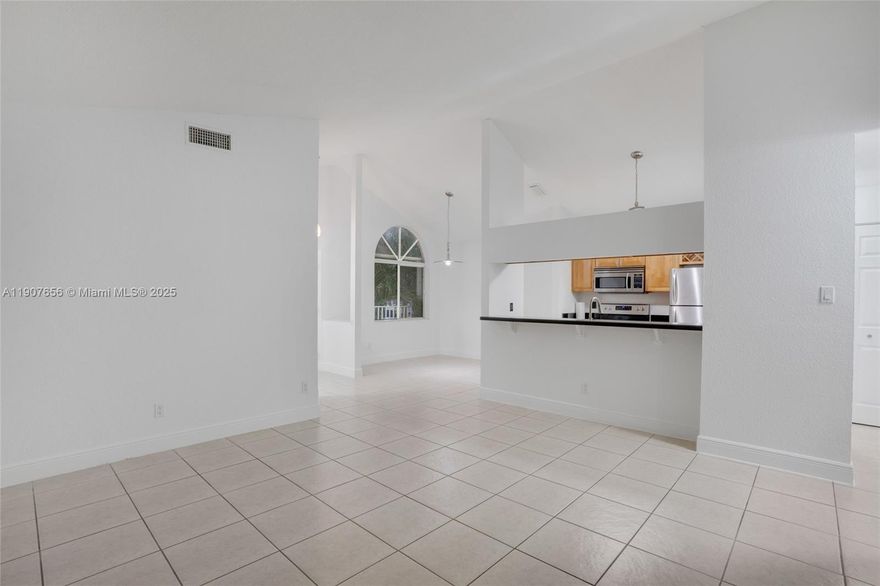 Beautiful and spacious 2BD/2BA condo in sought-after Royal Palm Place! Located on the 2nd floor, this unit features a peaceful garden entrance and a balcony with park and tree views—no buildings in sight. Enjoy stainless steel appliances, wood cabinets, granite countertops, washer/dryer, new vertical blinds, accordion shutters, and central A/C. Plenty of closet space plus outdoor storage. Two parking spaces (one covered). Small pets welcome! Community offers 2 pools, gym, tennis, basketball, playground, and direct access to Hammocks walking trails.